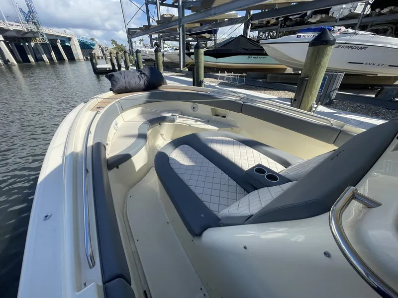 Slide: The Image of 2021 Chris-Craft Catalina 30 boat with luxurious seating at a marina dock. - 9