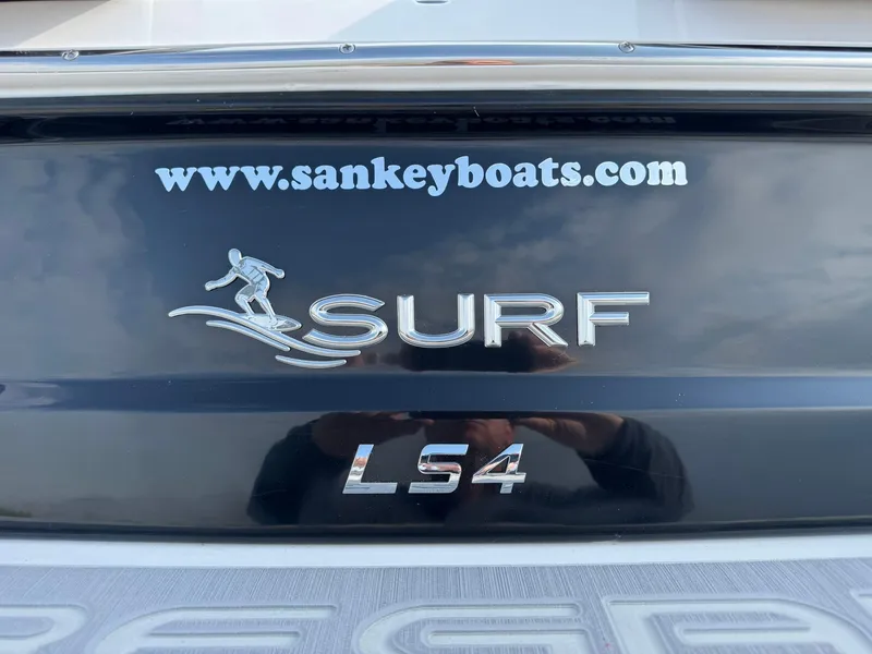 Slide: The Image of 2025 Regal LS4 Surf boat rear view with website URL. - 15