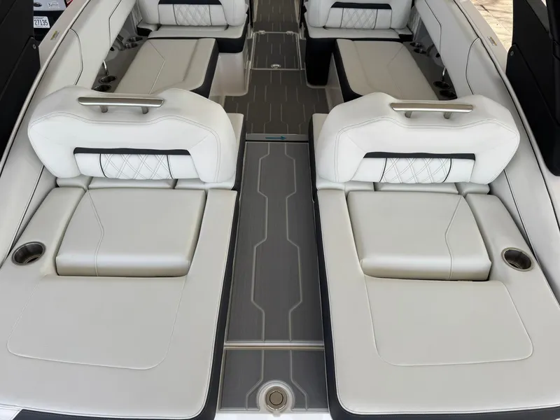 Slide: The Image of 2025 Regal LS4 Surf boat interior with luxurious white seating and modern design. - 20