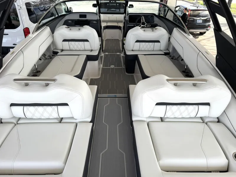 Slide: The Image of 2025 Regal LS4 Surf boat interior with luxurious white seating and modern design. - 21