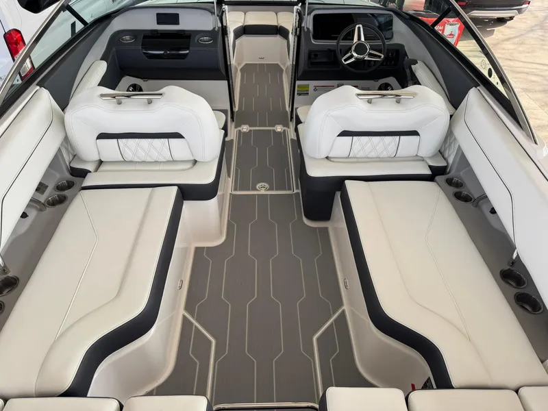 Slide: The Image of 2025 Regal LS4 Surf boat interior with white seating and modern dashboard. - 22