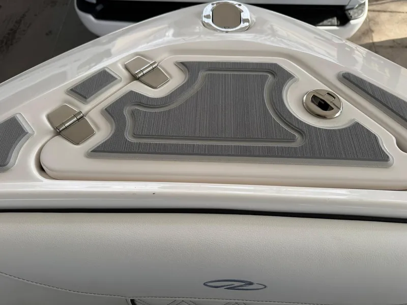 Slide: The Image of 2025 Regal LS4 Surf boat deck with sleek design and modern fittings. - 33