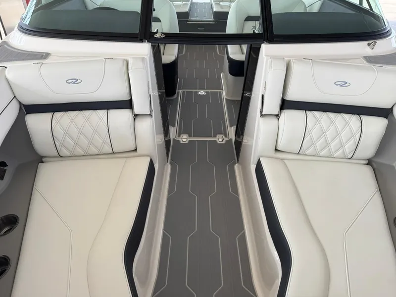 Slide: The Image of 2025 Regal LS4 Surf boat interior with luxurious white seating and modern design. - 35
