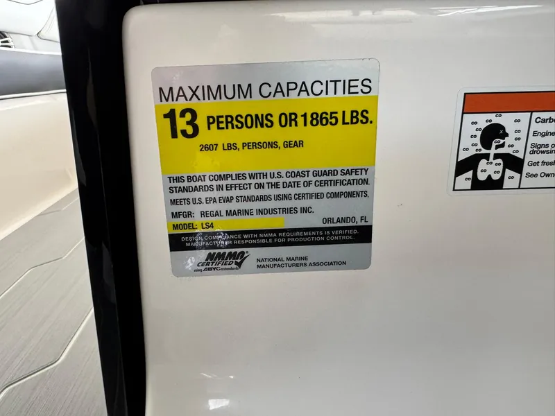 Slide: The Image of 2025 Regal LS4 Surf capacity label: 13 persons or 1865 lbs, compliant with safety standards. - 39