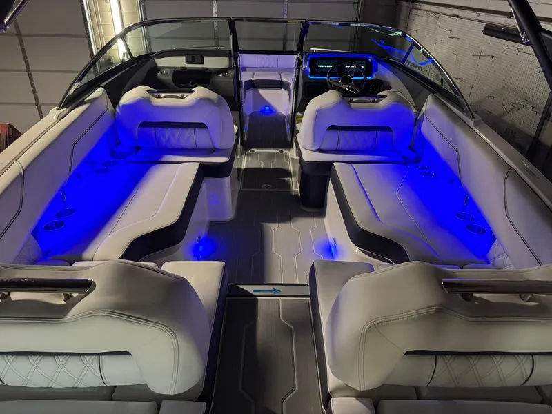 Slide: The Image of 2025 Regal LS4 Surf boat interior with blue LED lighting and luxurious seating. - 42