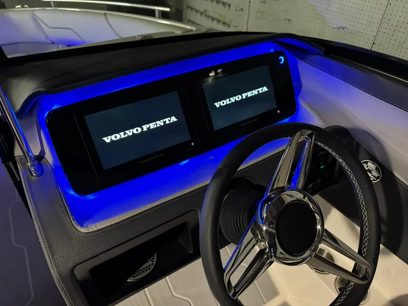 Slide: The Image of 2025 Regal LS4 Surf dashboard with dual Volvo Penta displays and illuminated controls. - 44