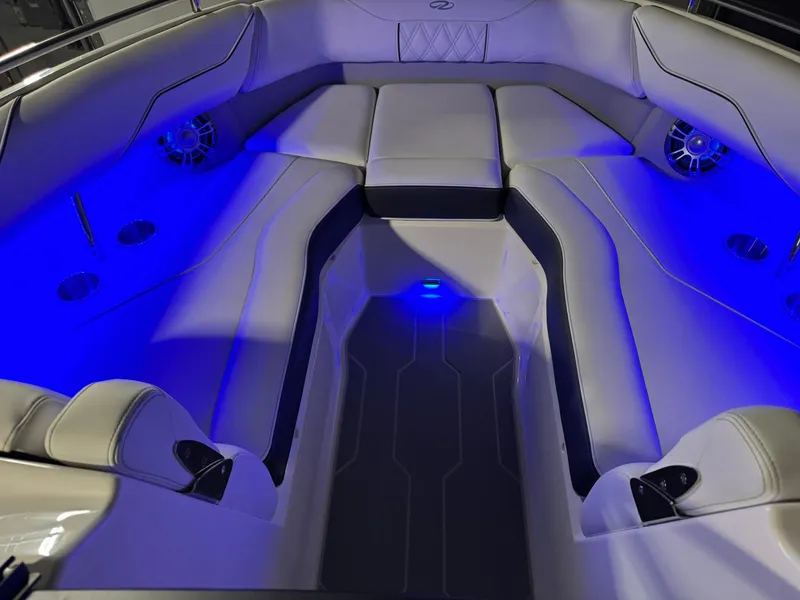 Slide: The Image of 2025 Regal LS4 Surf boat interior with blue LED lighting and luxurious seating. - 45