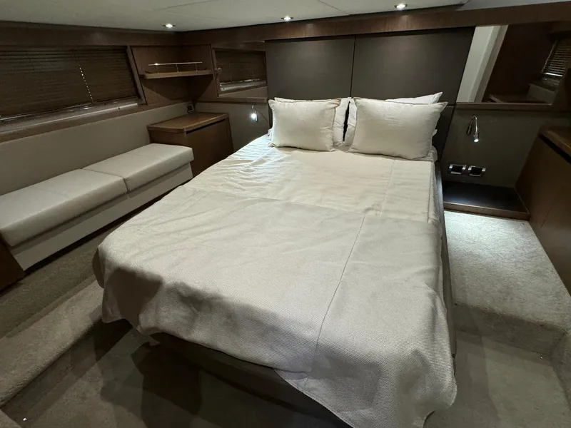 Slide: The Image of Luxurious 2017 Sea Ray Sundancer 460 cabin with elegant bedding and modern interior design. - 14
