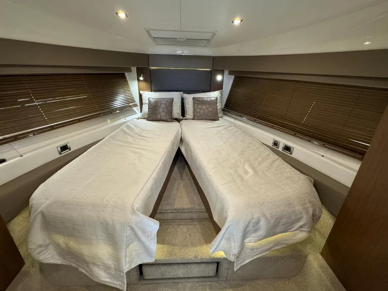 Slide: The Image of 2017 Sea Ray Sundancer 460 cabin with twin beds and modern interior design. - 24