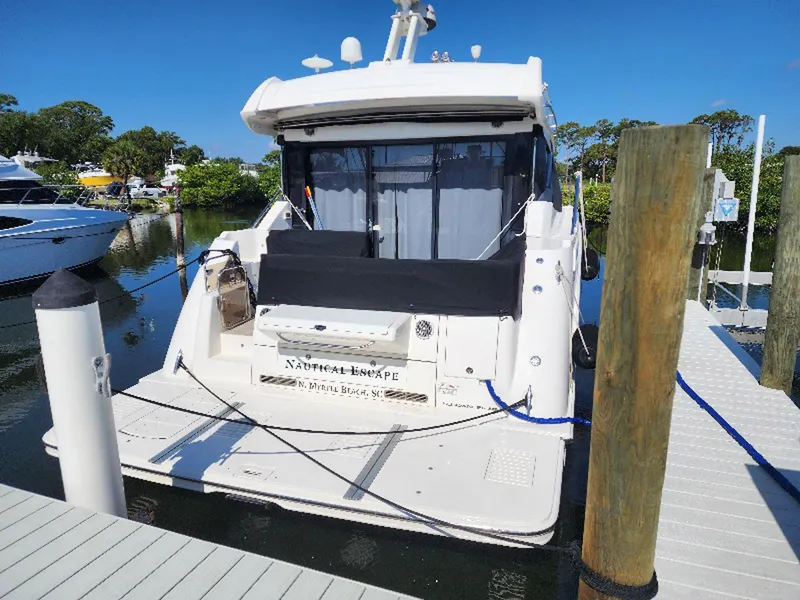 Slide: The Image of 2017 Sea Ray Sundancer 460 yacht docked at marina, rear view, sunny day. - 3