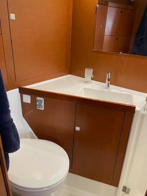 Slide: The Image of Interior of 2016 Beneteau Oceanis 45 yacht with modern seating and dining area. - 22