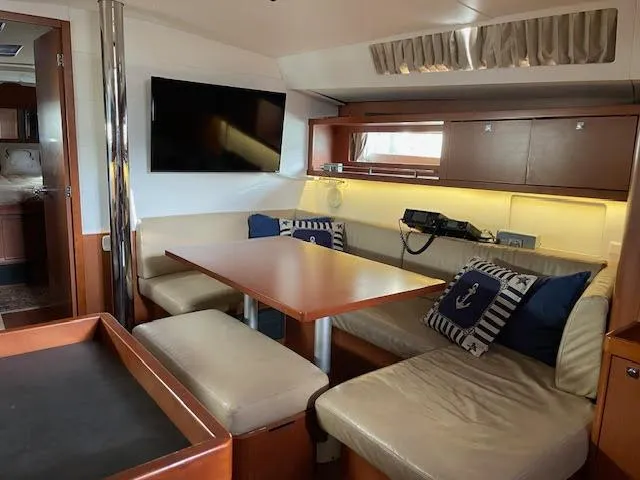 Slide: The Image of 2016 Beneteau Oceanis 45 yacht bathroom with modern fixtures and wooden cabinetry. - 25