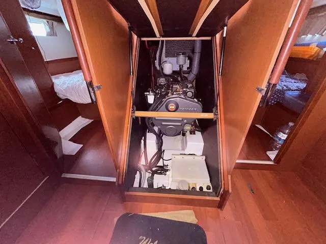 Slide: The Image of Engine room of 2016 Beneteau Oceanis 45 sailboat, featuring a compact engine setup. - 27