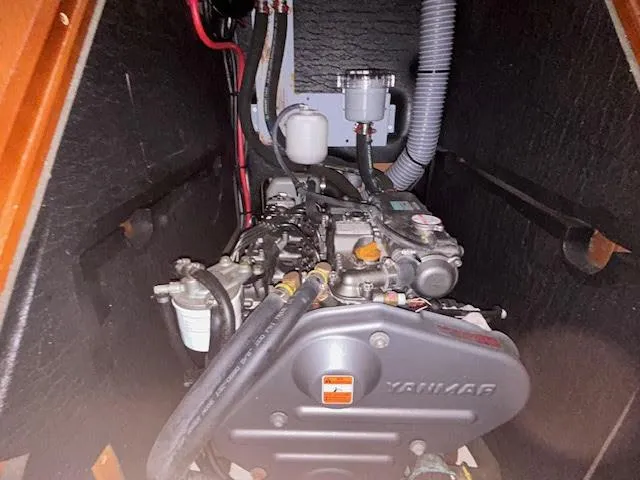 Slide: The Image of Engine compartment of a 2016 Beneteau Oceanis 45 sailboat, showing hoses and components. - 30