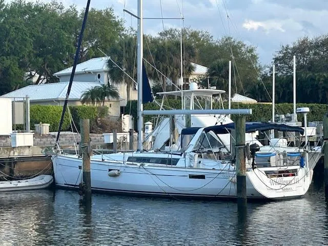 Slide: The Image of 2016 Beneteau Oceanis 45 sailboat docked in a marina setting. - 4