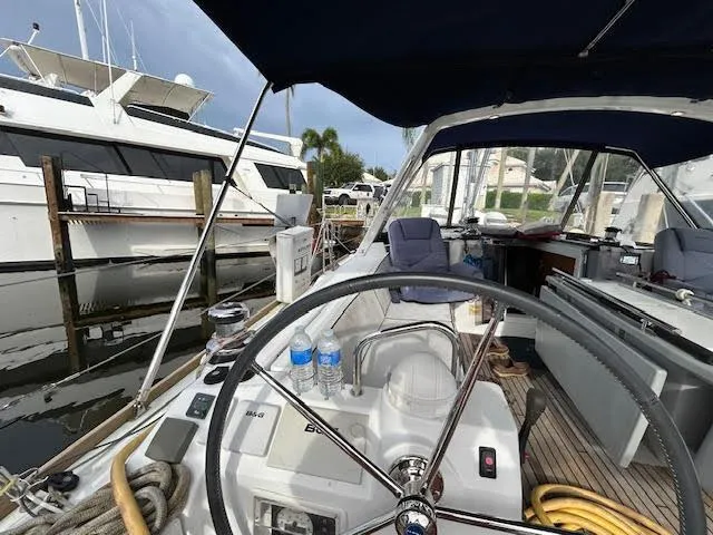 Slide: The Image of Beneteau Oceanis 45 sailboat cockpit, 2016 model, docked with steering wheel and equipment visible. - 7