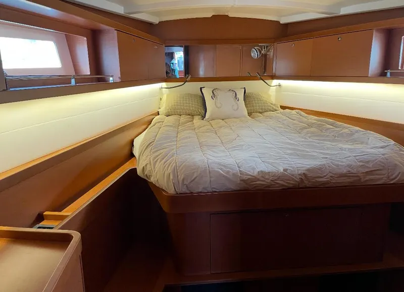 Slide: The Image of Luxurious cabin interior of 2016 Beneteau Oceanis 45 yacht with cozy bedding. - 9