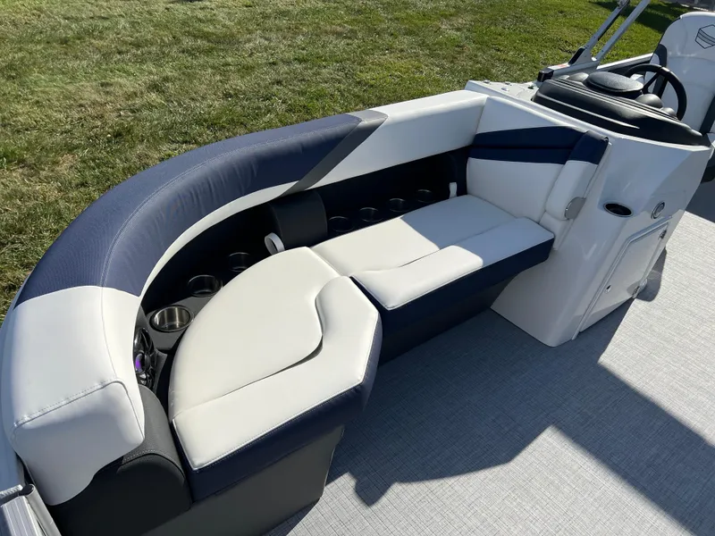 Slide: The Image of 2025 South Bay S 220CR2 boat interior with plush seating and cup holders. - 10