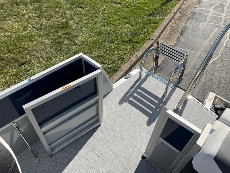 Slide: The Image of 2025 South Bay S 220CR2 boat deck with ladder and storage compartments. - 17