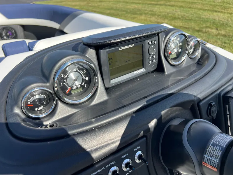 Slide: The Image of 2025 South Bay S 220CR2 dashboard with gauges and Lowrance display. - 24