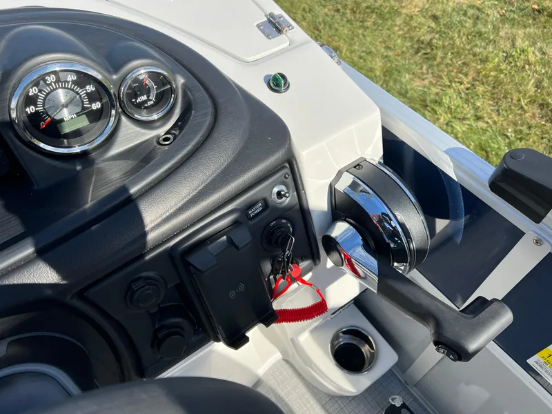 Slide: The Image of 2025 South Bay S 220CR2 boat dashboard with controls and gauges. - 25
