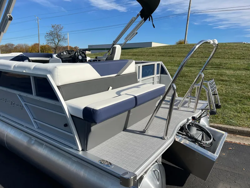 Slide: The Image of 2025 South Bay S 220CR2 pontoon boat with sleek seating and modern design. - 7