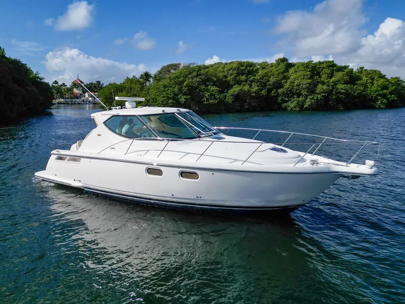 Slide: The Image of 2008 Tiara Yachts 3900 Sovran cruising on a serene waterway. - 16