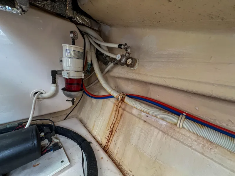 Slide: The Image of Engine compartment of 2008 Tiara Yachts 3900 Sovran with visible wiring and filter system. - 27