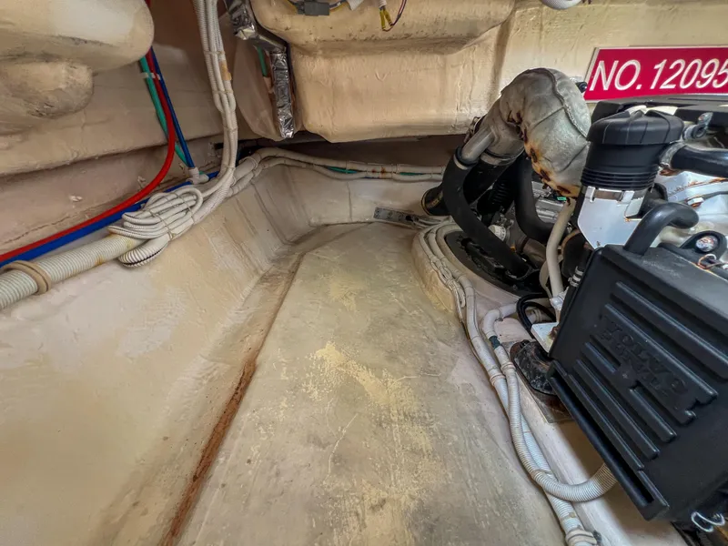 Slide: The Image of 2008 Tiara Yachts 3900 Sovran engine compartment with visible wiring and components. - 28