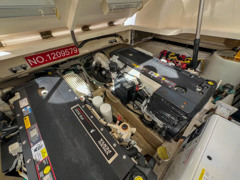 Slide: The Image of Engine compartment of 2008 Tiara Yachts 3900 Sovran, showcasing dual engines and mechanical components. - 29