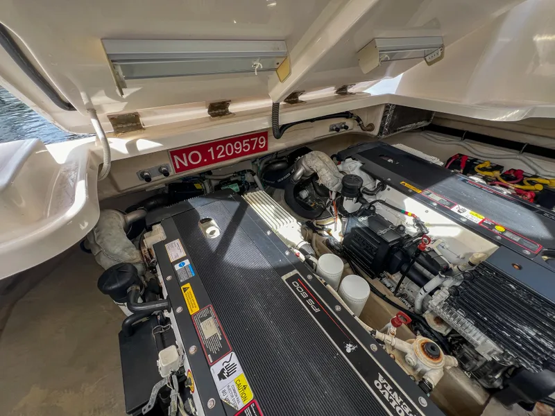 Slide: The Image of Engine compartment of 2008 Tiara Yachts 3900 Sovran, showcasing dual engines and mechanical components. - 30