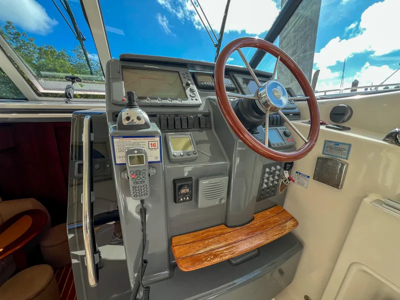 Slide: The Image of 2008 Tiara Yachts 3900 Sovran helm with steering wheel and navigation equipment. - 39
