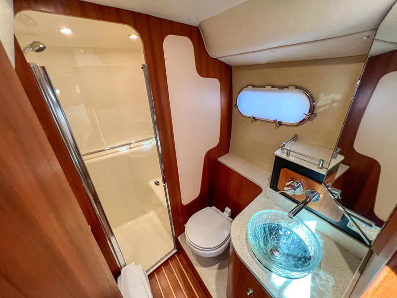 Slide: The Image of Luxurious bathroom in 2008 Tiara Yachts 3900 Sovran with glass sink and shower. - 46
