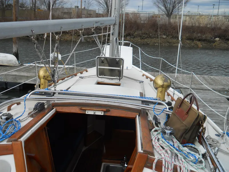 Slide: The Image of 1987 Catalina C-34 sailboat docked, showing deck and rigging details. - 5