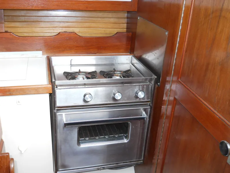 Slide: The Image of Stainless steel stove and oven in 1987 Catalina C-34 yacht kitchen. - 8