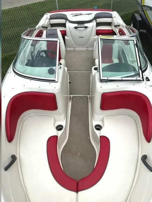 Slide: The Image of 2006 Sea Ray 205 Sport boat with red and white interior, open bow seating. - 1