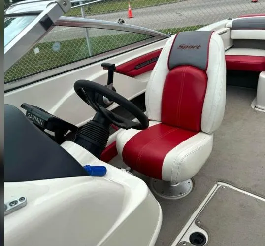 Slide: The Image of Interior of a 2006 Sea Ray 205 Sport boat with red and white seating. - 3