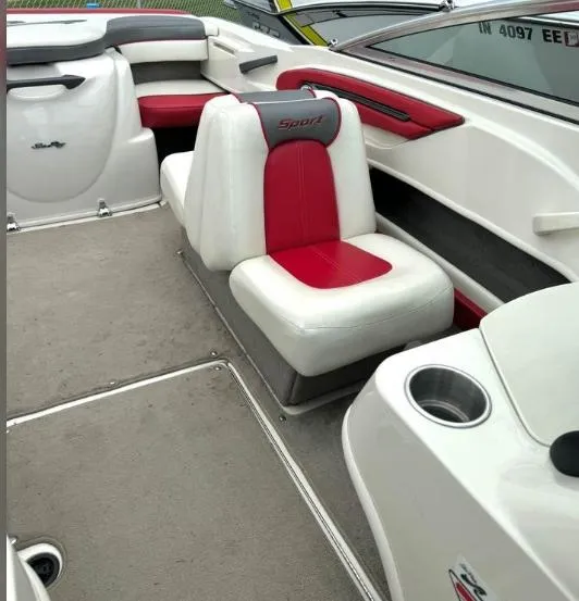 Slide: The Image of Interior of a 2006 Sea Ray 205 Sport boat with red and white seating. - 4