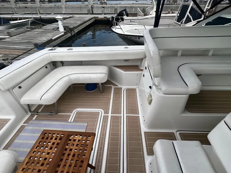 Slide: The Image of 2001 Tiara Yachts 2900 Coronet interior with white seating and wooden flooring. - 15