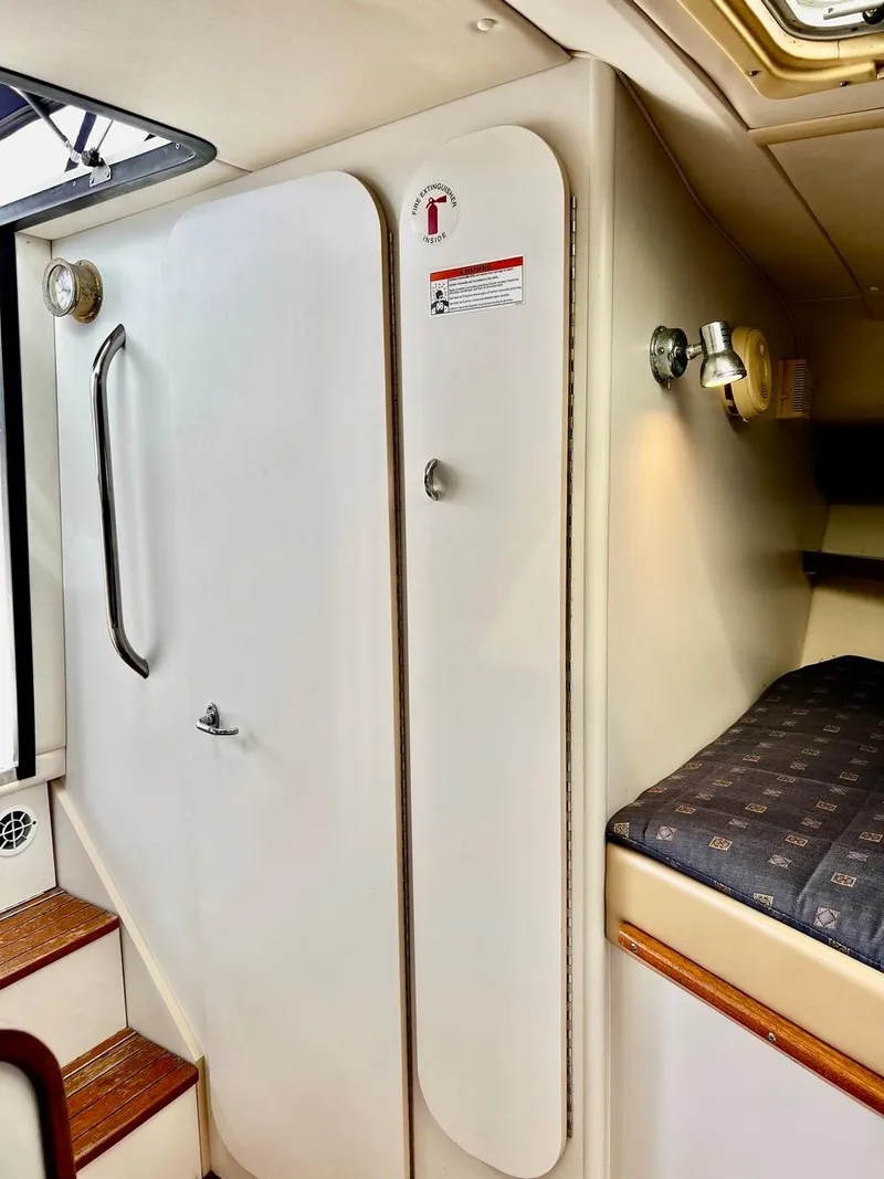 Slide: The Image of Interior of 2001 Tiara Yachts 2900 Coronet with cabin door and bed. - 19