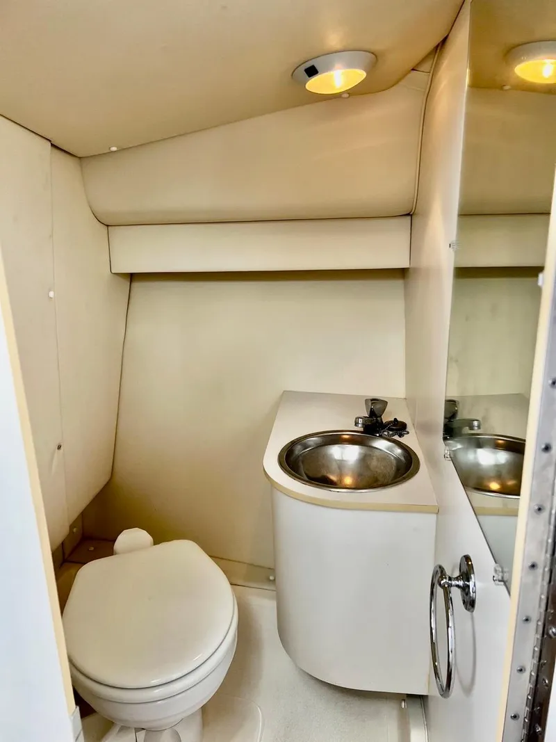 Slide: The Image of 2001 Tiara Yachts 2900 Coronet bathroom with sink and toilet. - 20