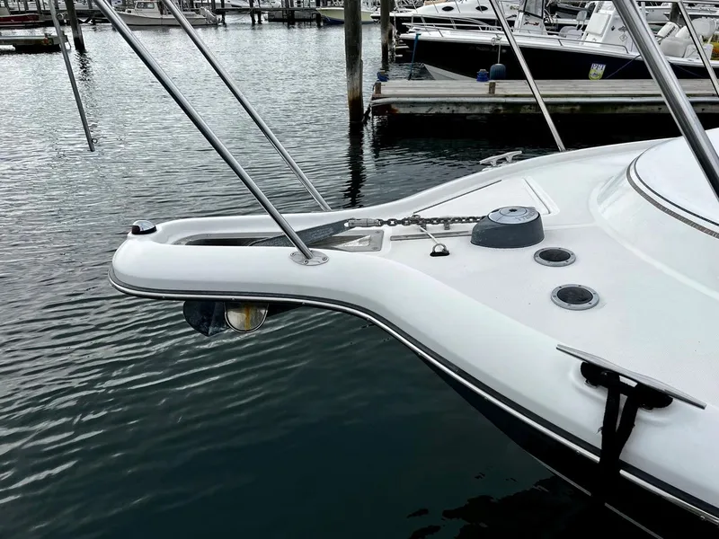 Slide: The Image of 2001 Tiara Yachts 2900 Coronet bow at marina, showcasing sleek design and mooring details. - 7