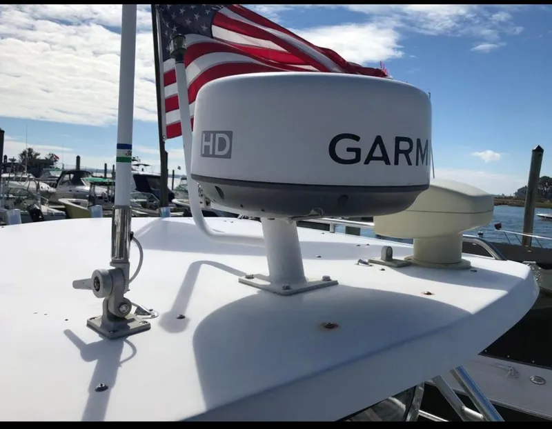 Slide: The Image of 2002 Seaswirl Striper 2601 Walkaround with Garmin radar and American flag. - 15
