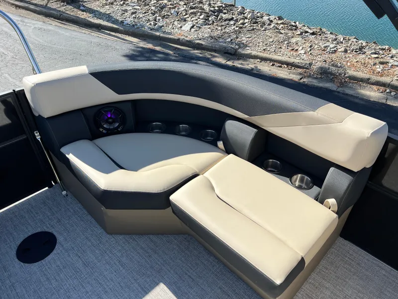 Slide: The Image of Luxurious seating on 2025 South Bay 220RS boat, featuring beige and black upholstery. - 12