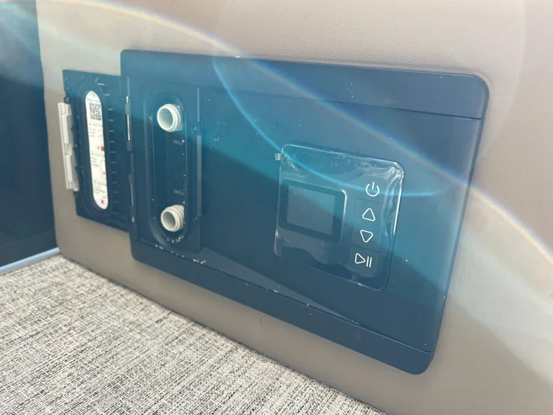 Slide: The Image of Control panel of 2025 South Bay 220RS boat with digital display and buttons. - 13