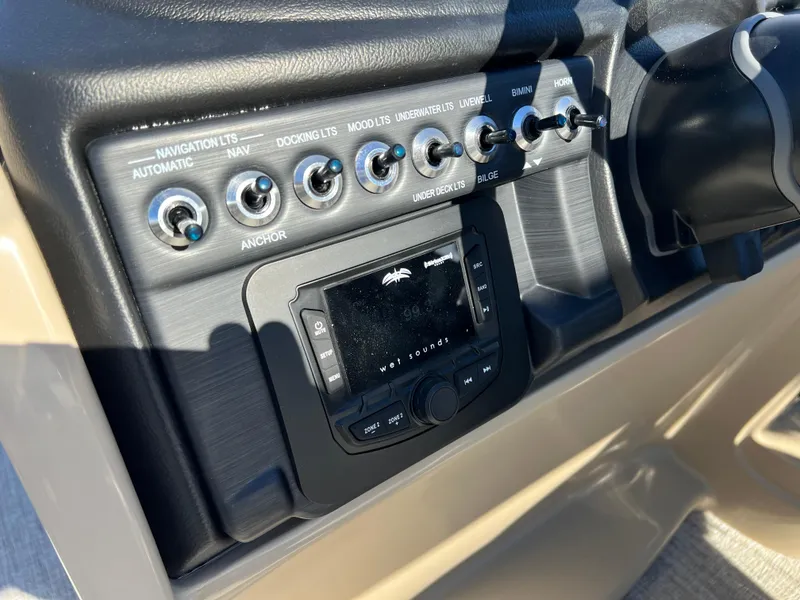 Slide: The Image of Control panel of 2025 South Bay 220RS boat with navigation and docking switches. - 18