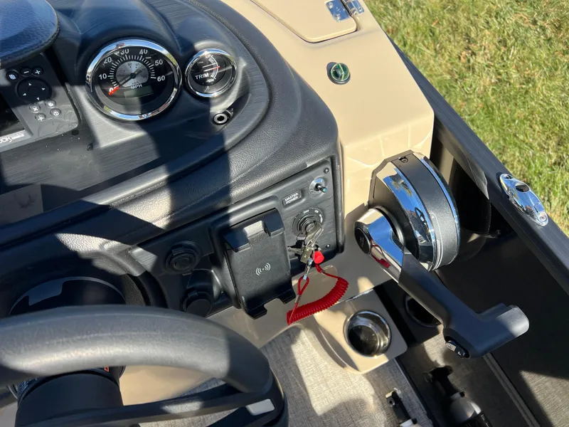 Slide: The Image of 2025 South Bay 220RS boat dashboard with controls and gauges. - 20