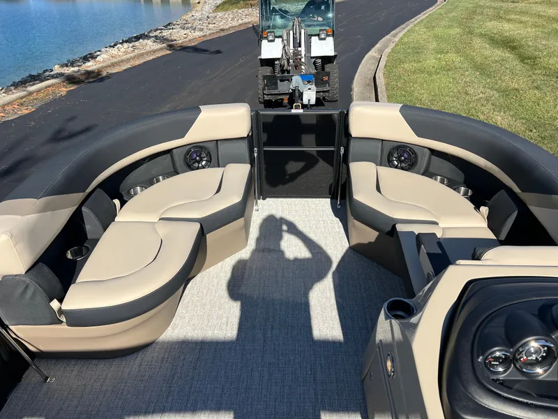 Slide: The Image of 2025 South Bay 220RS pontoon boat interior with plush seating and modern design. - 21