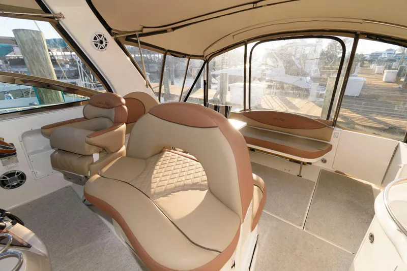 Slide: The Image of Interior of 2000 Sea Ray 380 Sundancer yacht with beige seating and panoramic windows. - 12