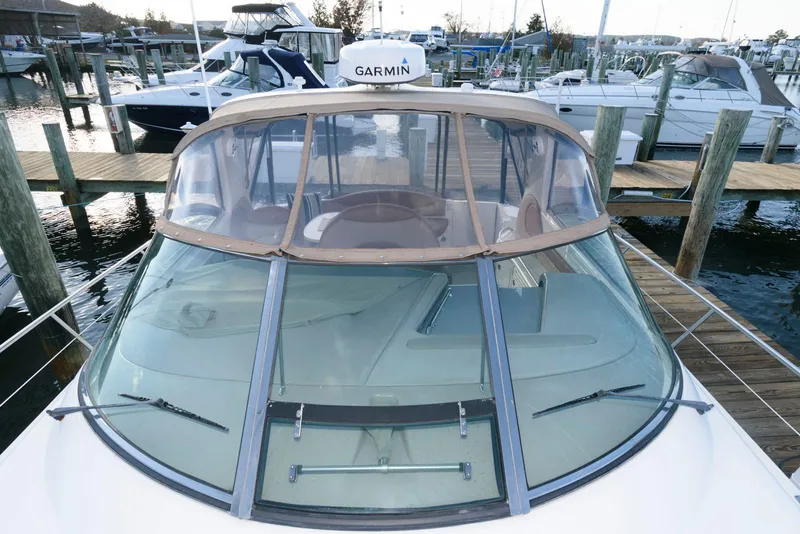 Slide: The Image of Sea Ray 380 Sundancer 2000 docked at marina with Garmin equipment. - 2